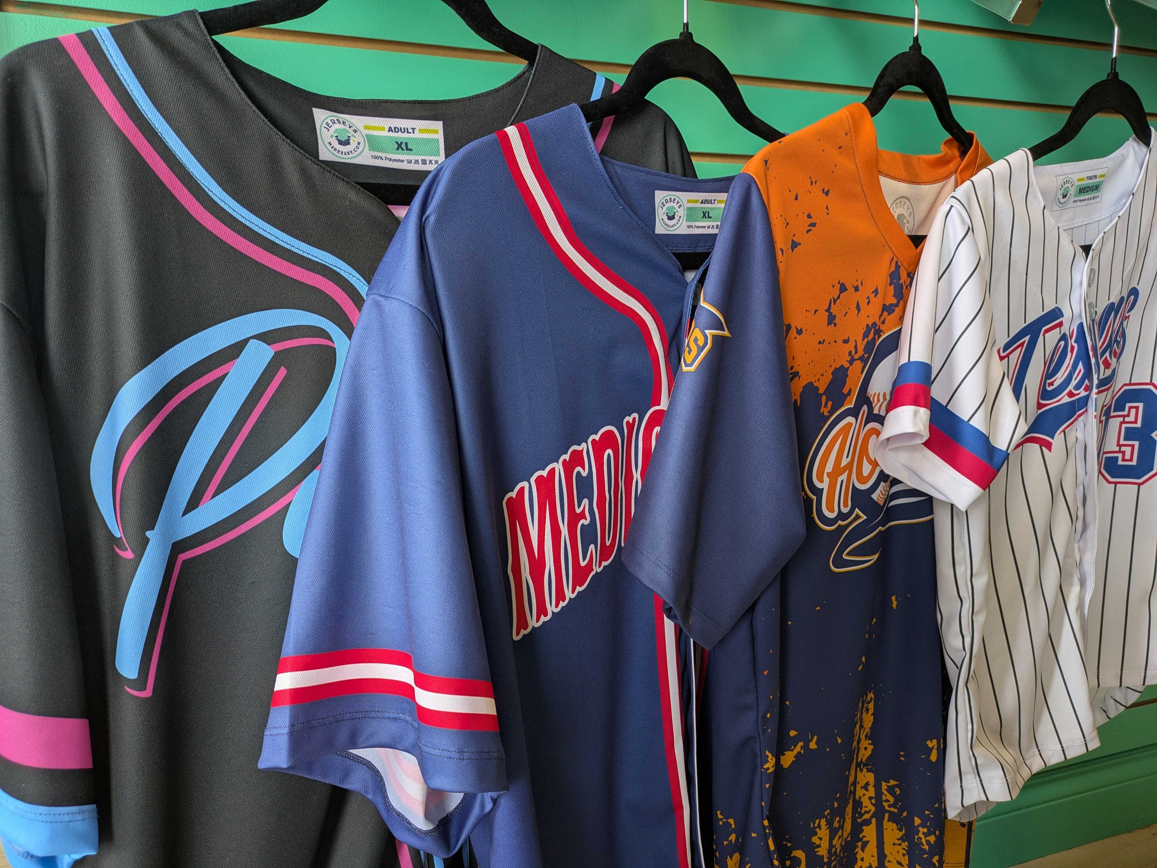 Sample Sublimated Baseball Jerseys With Different Designs in the JerseysMadeEasy Showroom in Kitchener, Ontario, Canada