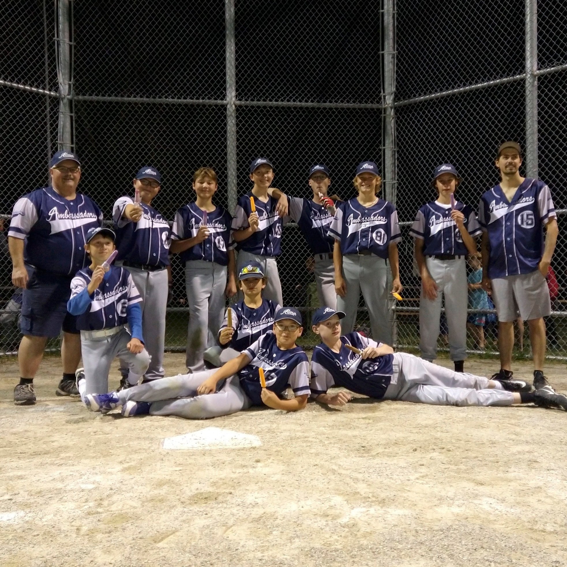 A team photo of team jerseys (sublimated full button) for an Ontario-based youth softball team
