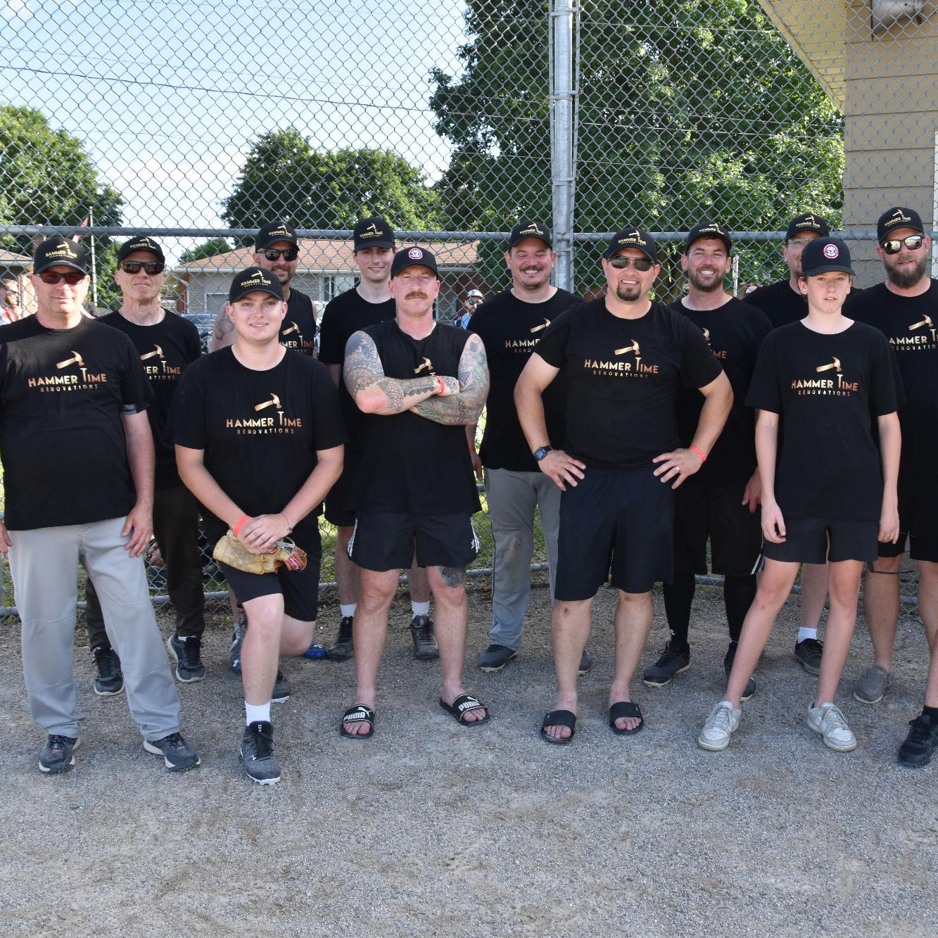 Team photo of basic baseball jerseys printed by JerseysMadeEasy on plain black t-shirts